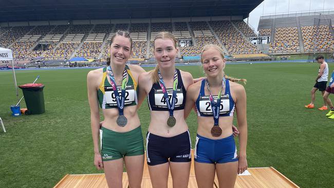 Another Moreton Bay College student, Amelia Sherrard, struck gold. Pictured middle, alongside Lola Bowen, left, and Julia Wainwright.