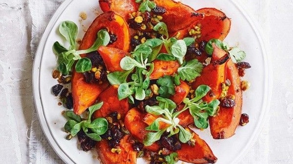 Roast pumpkin salad with cranberries and pistachio.