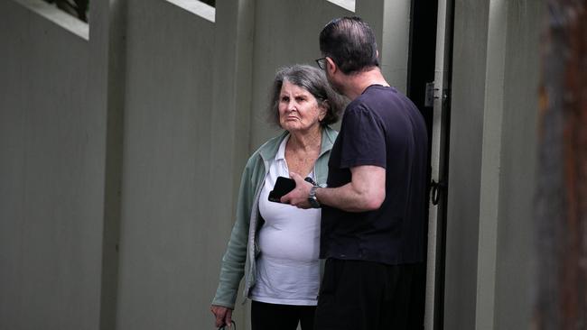 Local residents of Magney street watch on as police conduct interviews. Picture: NewsWire / Gaye Gerard