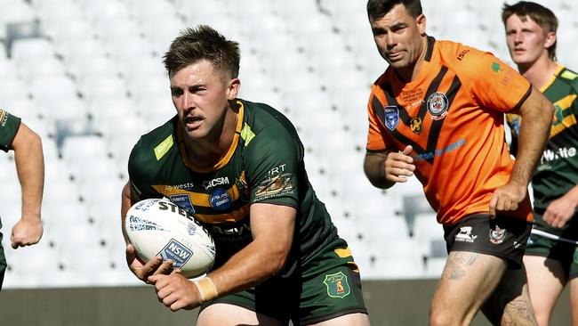 Mittagong's Byron Pinkerton heads up field. Picture: John Appleyard