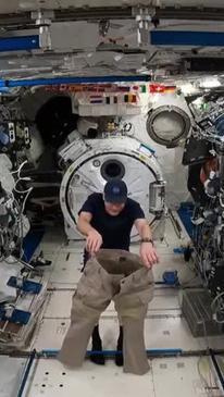 Moment Astronaut Puts on Pants Two Legs at a Time