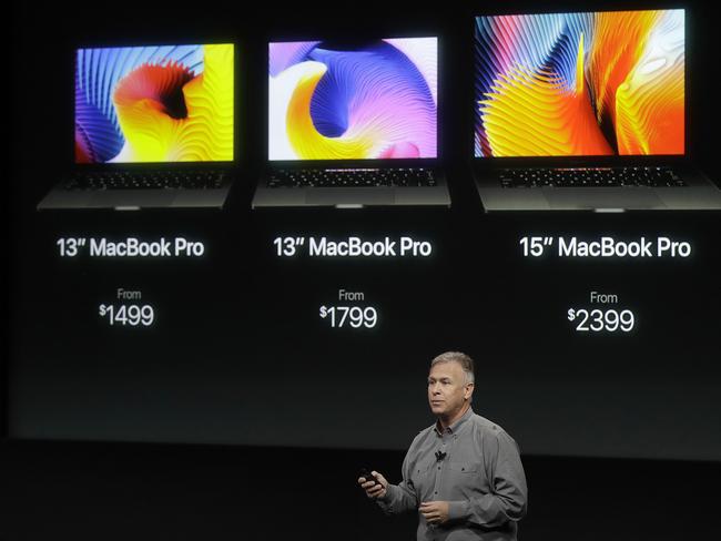 Phil Schiller, Apple's senior vice president of worldwide marketing, shows US prices for the MacBooks.   The 13 inch will cost $2199, the 13 inch with Touch Bar will cost $2699 and the 15 inch will cost $3599 in Australia. Picture:  AP