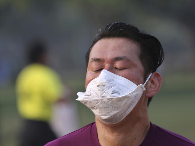 A participant wears a mask as he runs during the Delhi Half Marathon in New Delhi, India. Picture: Oinam Anand/AP