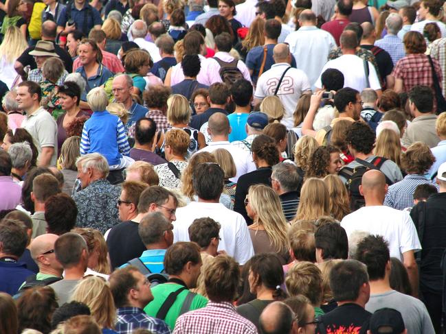 Census population Inner West Courier Amsterdam, The Netherlands - August 21, 2010: A large crowd of people walking along the water front at the Veemkade street on the Sail Amsterdam event in Amsterdam, The Netherlands on August 21, 2010