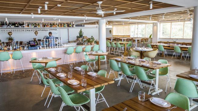 The Tropic is a pastel-hued haven and inside it is maintly mint green chairs at wooden tables.