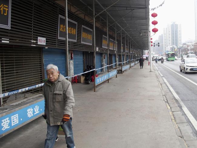 This Jan. 17, 2020, photo, shows the closed Huanan Seafood Wholesale Market in Wuhan, China. China reported Monday, Jan. 20 a sharp rise in the number of people affected in a pneumonia outbreak caused by a new coronoavirus, including the first cases in the capital. (Kyodo News via AP)