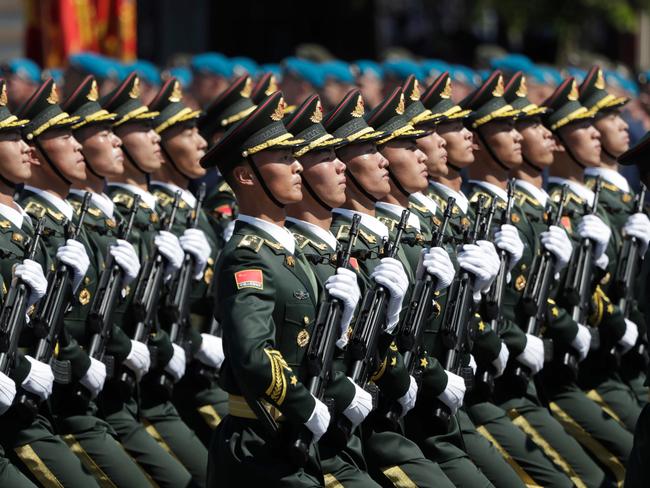 Soldiers from China's People's Liberation Army march on Red Square during a military parade. Picture: Pavel Golovkin