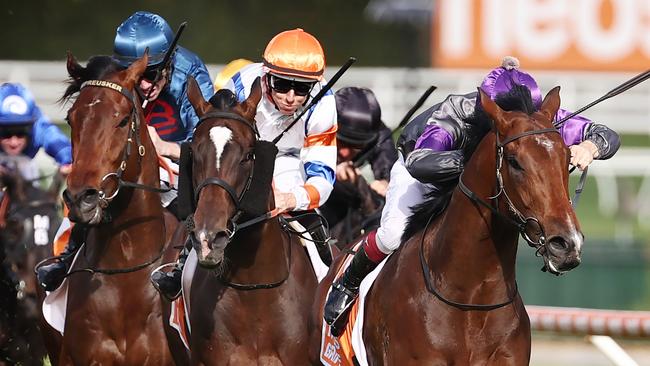 Griff (right) wins the Caulfield Guineas.