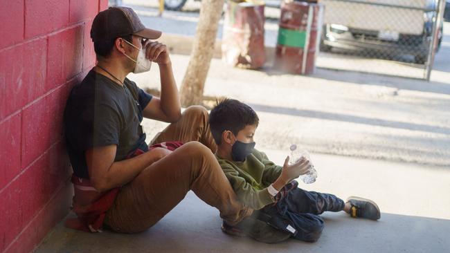 Jesus and his son, right, crossed the border in the Rio Grande Valley, were flown from Brownsville to El Paso, Texas, and expelled to Mexico. Picture: AFP