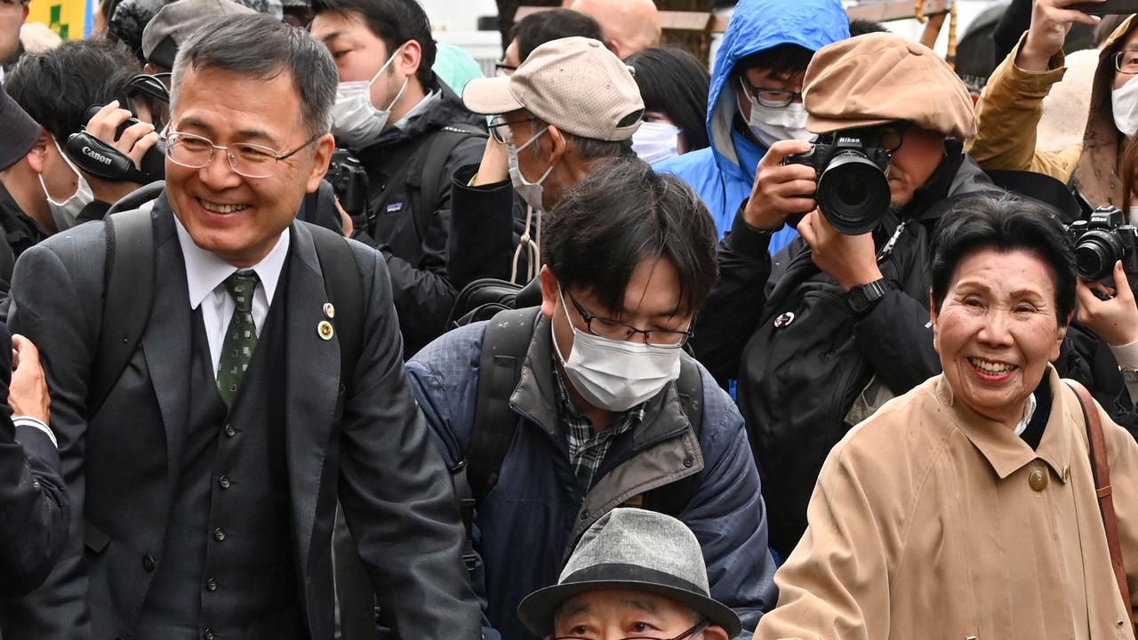 ‘Finally a weight has been lifted from my shoulders,’ his sister (right) told reporters after a retrial was announced. Picture: AFP