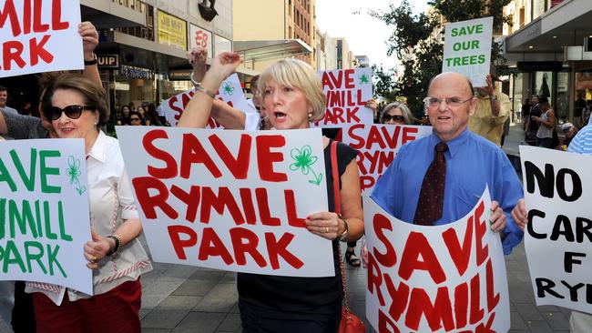 Protesters take to Rundle Mall to oppose the O-Bahn extension through Rymill Park.