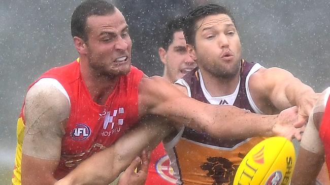 Ruckmen Jarrod Witts and Stefan Martin battle in tough conditions.