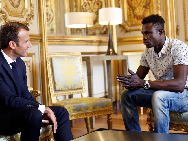 The 22-year-old was praised as a ‘hero’ by the toddler’s family after meeting French President Emmanuel Macron following the daring fifth-floor rescue. Picture: AFP Photo / Pool / Thibault Camus