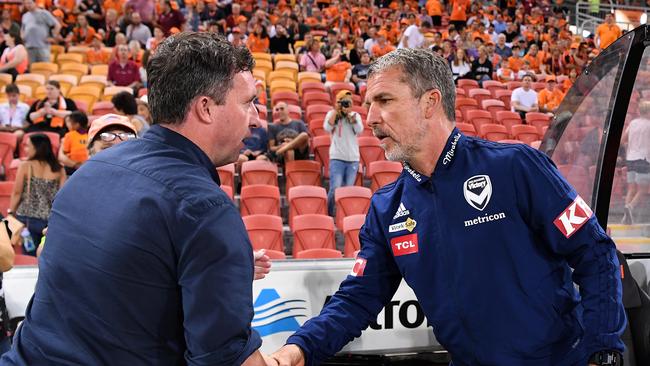 Brisbane Roar coach Robbie Fowler (left) shakes hands with his Melbourne Victory counterpart Marco Kurz at Suncorp Stadium on Friday night. (AAP Image/Dan Peled)