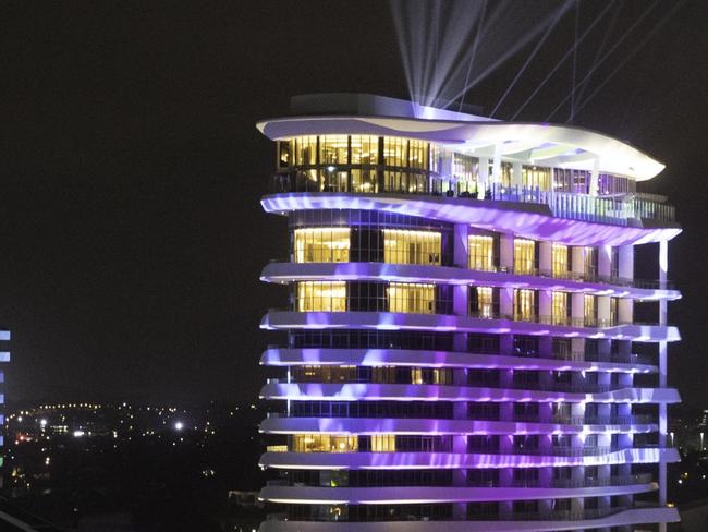 The Star Gold Coast's original Star Grand hotel (left) and The Darling all lit up in Broadbeach as it launches it's new luxury 17-storey hotel The Darling