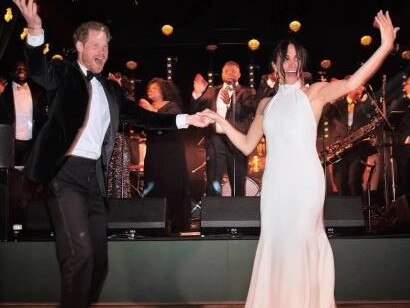 The pair dance at their reception as Meghan Markle flashes her wedding band. Picture: Netflix