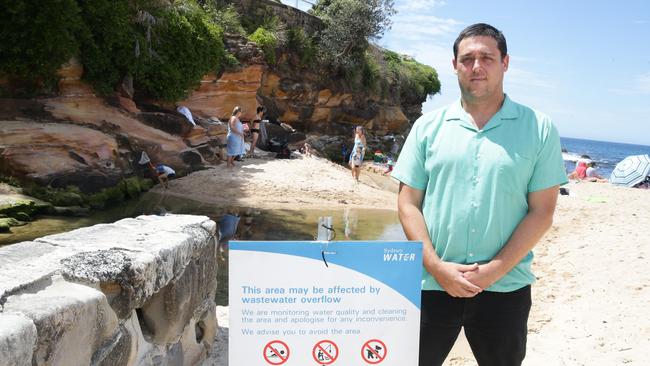 Stuart Khan in front of the stormwater overflow pipe at Coogee Beach. Picture: Craig Wilson