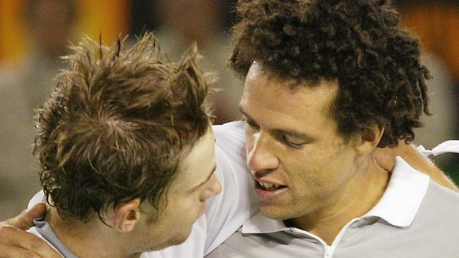 Andy Roddick and Younes El Aynaoui after their marathon match in 2003.