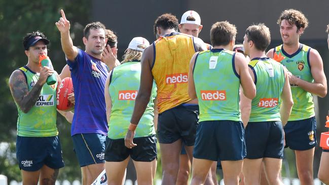 Hawthorn legend Luke Hodge helps coach the young Lions in March this year, having finished his playing career in Brisbane on a short contract. Picture: AAP Image/Darren England