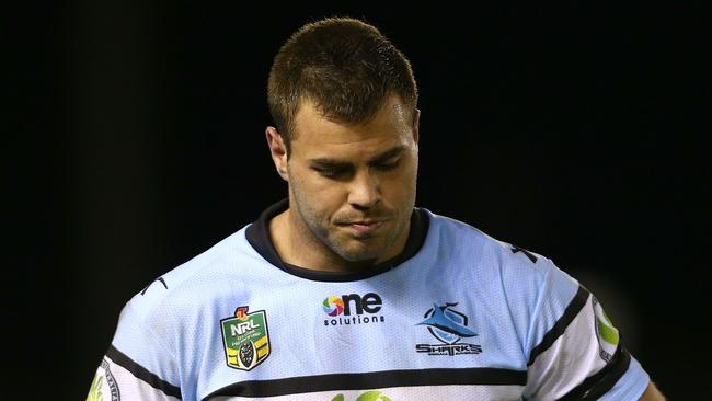 SYDNEY, AUSTRALIA - JULY 18: Dejected Sharks captain Wade Graham leaves the field after the round 16 NRL match between the Cronulla Sharks and the North Queensland Cowboys at Remondis Stadium on July 18, 2014 in Sydney, Australia. (Photo by Renee McKay/Getty Images)