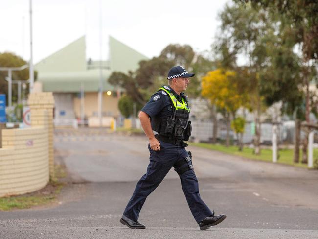 Police and media watch on as George Pell leaves Barwon Prison in Anakie, Victoria, after the High Court quashed his conviction. Picture: Mark Stewart