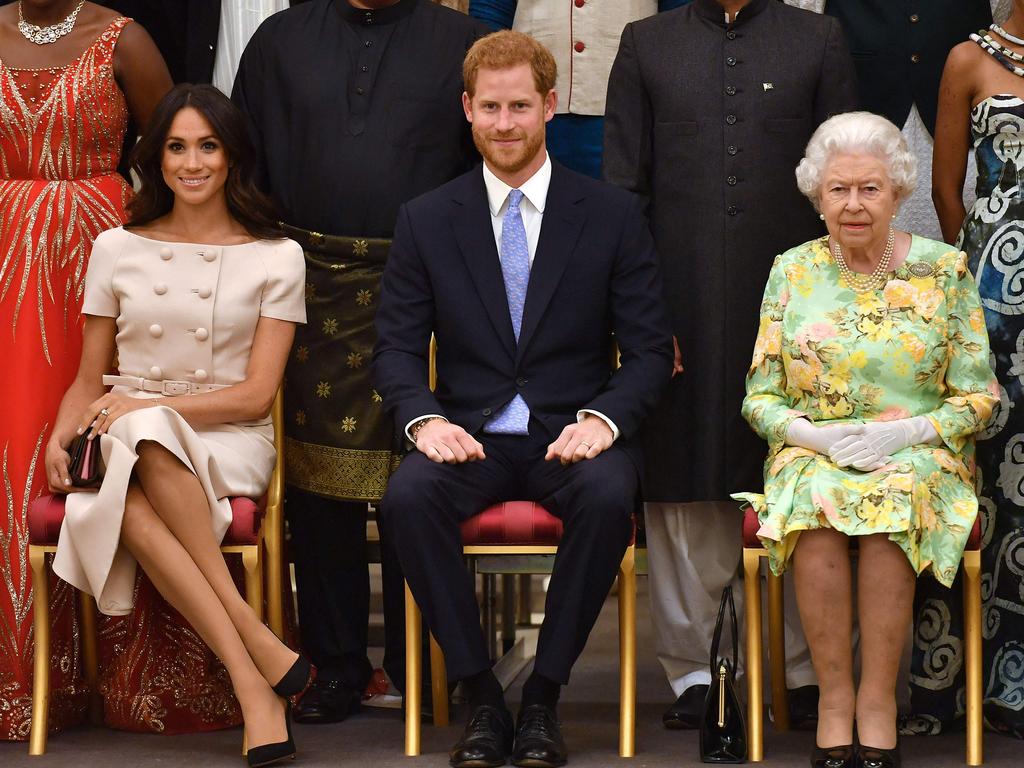 Meghan, Prince Harry and Queen Elizabeth II in 2018. Picture: John Stillwell/AFP