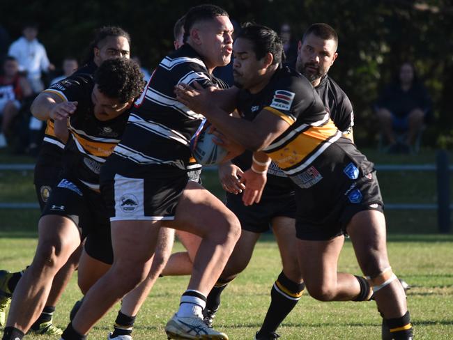 Andre Wright is tackled by Drey Mercy. Picture: Sean Teuma/NewsLocal