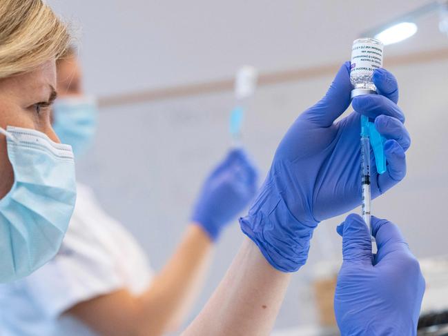 Syringes are loaded with the AstraZeneca Covid-19 Vaccine at the Skane University Hospital vaccination centre in Malmo, Sweden, on February 17, 2021. (Photo by Johan NILSSON / TT NEWS AGENCY / AFP) / Sweden OUT