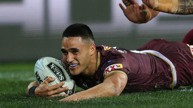 Valentine Holmes crosses the line first. (AAP Image/Jono Searle)