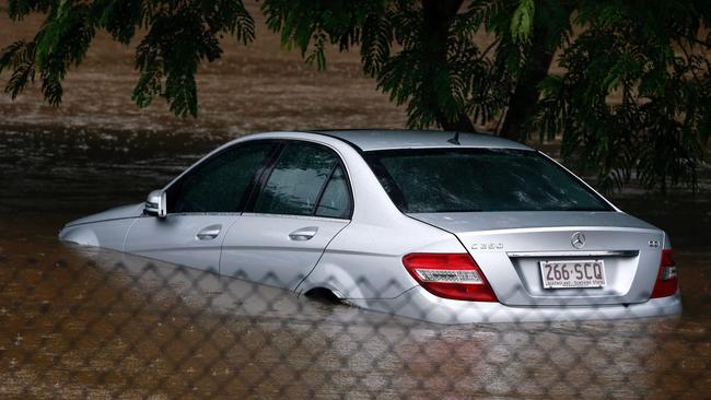 Flood waters enter in the parking lot outside the Robina Hospital on the Gold Coast. Photo: AFP