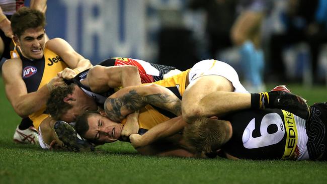 Dustin Martin, middle, gets some attention from St Kilda players last year. Picture: Wayne Ludbey