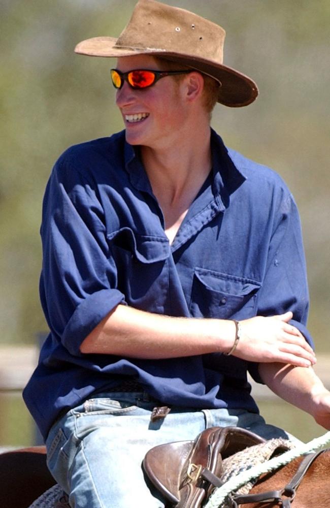 Prince Harry musters cattle on a horse called Guardsman on the outback property of Tooloombilla in central Queensland in late 2003. Picture: AP Photo