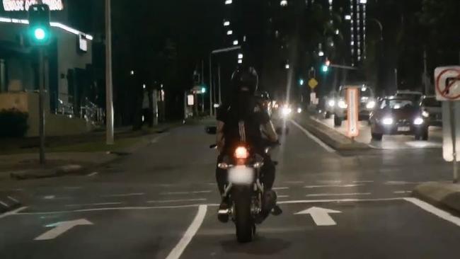 The man riding his motorbike through Surfers Paradise. Photo: VICE