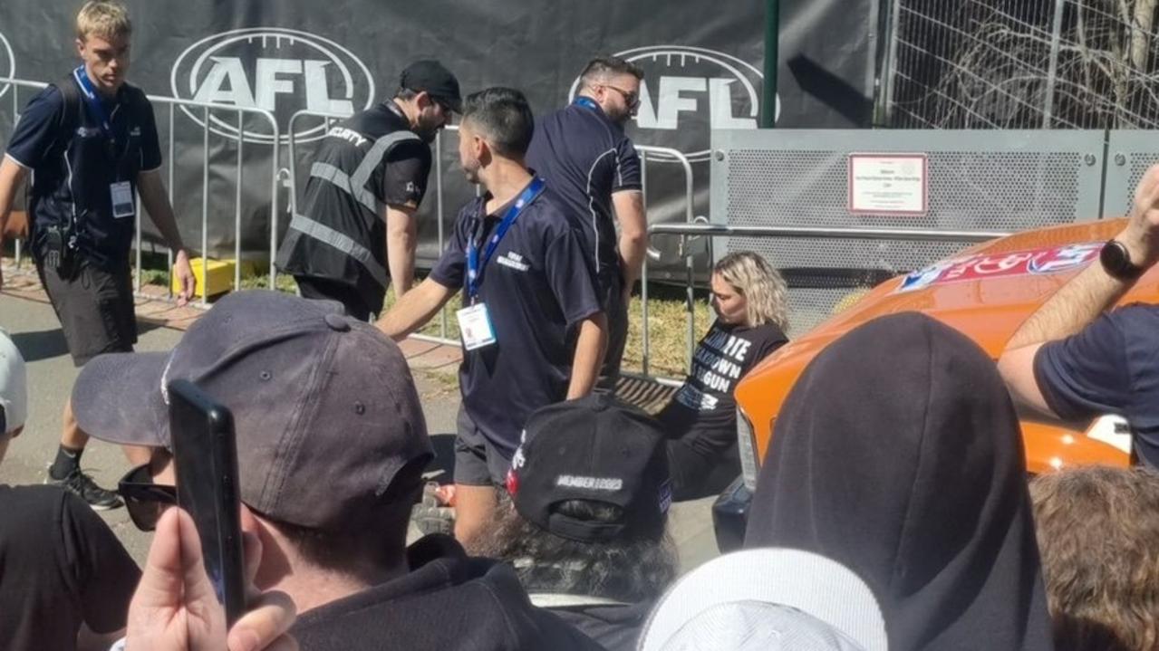 Climate protesters temporarily stop the AFL Grand Final parade. Picture: Twitter