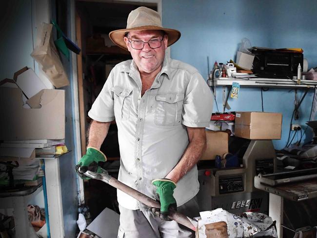 CYCLONE AFLRED: Mop up begins at Nambour Print and Copy. Steve Nixon helping hand. Photo: Patrick Woods.