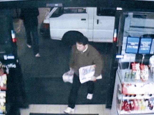 The last image of Min Lin alive as he delivered newspapers to a service station at 9.45pm on July 17, 2009.