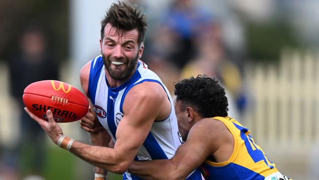 HOBART, AUSTRALIA - AUGUST 10: Luke McDonald of the Kangaroos is tackled by Tyrell Dewar of the Eagles during the round 22 AFL match between North Melbourne Kangaroos and West Coast Eagles at Blundstone Arena, on August 10, 2024, in Hobart, Australia. (Photo by Steve Bell/Getty Images)