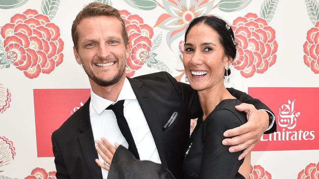 Lindy Klim and her new boyfriend Adam Ellis hug in the Emirates marquee on Derby Day at Flemington Racecourse in Melbourne, Saturday. Oct. 29, 2016. (AAP Image/Julian Smith) NO ARCHIVING, EDITORIAL USE ONLY