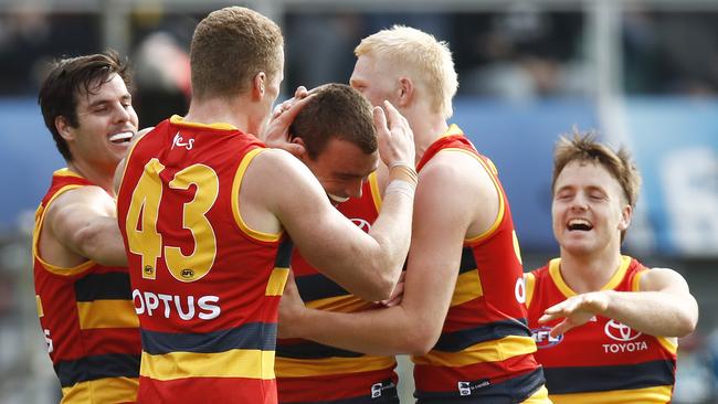 Riley Thilthorpe is mobbed by teammates after one of his five goals on debut.