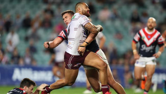 Radley putting one of the tackles of the season on Manly's Dylan Walker. Picture: Brett Costello