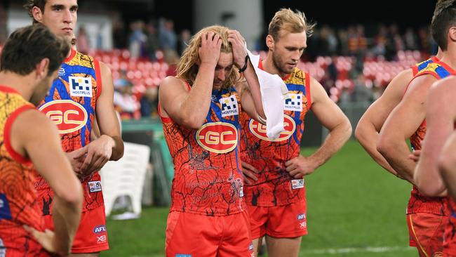 Suns players react following their second 90+ point loss in a row. Picture: AAP Image/Dave Hunt