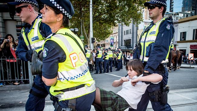 Students protesting federal budget cuts to higher education clashed with police as thousands of protesters marched through CBDs across the country on May 21, 2014. The rallies were part of a national day of action against the Government’s plan to deregulate university fees, and organised by the National Union of Students (NUS). Almost 2000 people marched from Melbourne’s State Library to Parliament House on Spring Street chanting, “No ifs, no buts, no education cuts”. There were arrests after small group refused to leave the protest area.