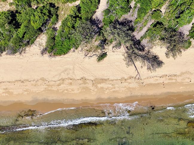 The jury on the murder trial of Toyah Cordingley has visited Wangetti Beach, 40 kilometres north of Cairns, to witness the site that Ms Cordingley died. Aerial photo of whereToyah Cordingley was buried in a shallow grave in the sand. A witches hat on the treeline marks the spot of the burial site. Picture: Brendan Radke