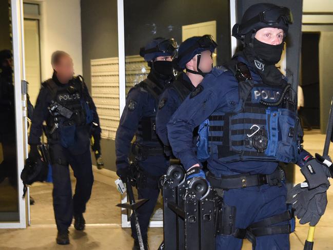 Police Drug raids in Richmond and Carlton. "Operation Mergers" Critical Incident Response Team members leaving the Drummond Street flats.Picture: Tony Gough