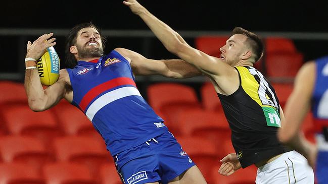 Josh Bruce hauls in a one-handed mark against Noah Balta. Picture: Michael Klein