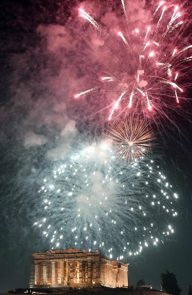 Fireworks explode by the Ancient Acropolis in Athens during the New Year celebrations. Picture: AFP