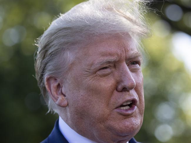 President Donald Trump speaks with reporters on the South Lawn as he departs the White House on Marine One, Friday, May 15, 2020, in Washington. Trump is en route to Camp David, Md. (AP Photo/Alex Brandon)