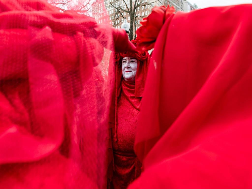 The Red Rebel Brigade participates in “The Funeral for Nature” with Extinction Rebellion at Boston Public Garden, urging climate action from Governor Maura Healey. Picture: Joseph Prezioso/AFP