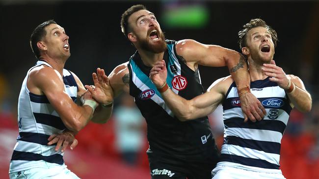 Geelong’s Harry Taylor and Lachie Henderson will have a big job to play on Port Adelaide spearhead Charlie Dixon next Thursday. Picture: Jono Searle/AFL Photos/via Getty Images