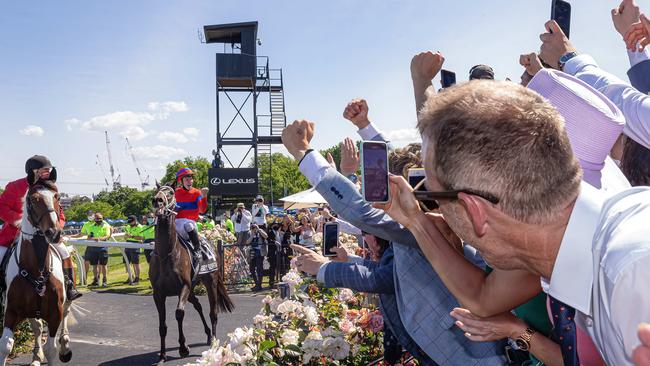 Crowds cheer on Very Elegant after winning the 2021 Lexus Melbourne Cup. Picture: Jason Edwards